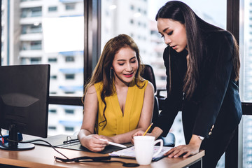 Successful of two casual business discussing and working with laptop computer.creative business people planning and brainstorm in modern office.Teamwork concept