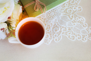 Beautiful flat lay a cup of tea with lace decorations for wedding background or valentines concept