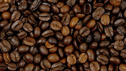 Roasted coffee beans background, Close Up mixture of different kinds of coffee beans.