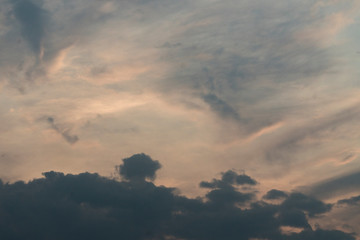 Background image of blue sky with clouds. Sunlight breaking through the clouds