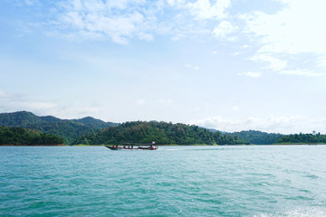 Wooden Thai Traditional Long Tail Boat on Chiao Lan Dam Khao Sok National Park in Thailand Holiday