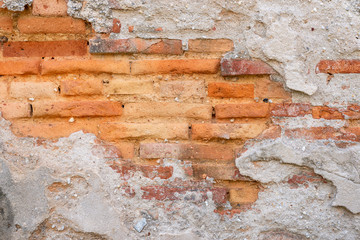 Old orange brick wall texture..Rough surface of old white plaster grunge wall with orange brickwall decoration , copy space use for background.