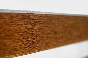 View down the side of a two fabric light filtering shade in open position 