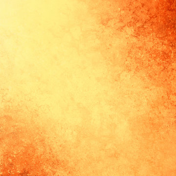 Yellow gold background with vintage texture grunge and orange fiery borders in warm autumn or tuscan colors