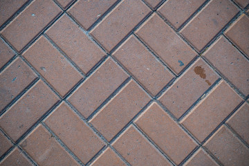 Texture of paving slabs overgrown with grass. Background image of a stratum stone