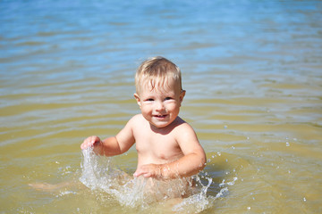 Carefree child plays in the water