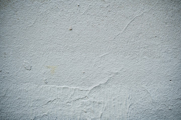 Texture of an old wall covered with paint. Background image of a worn paint coated surface