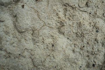 Texture of dried cracked clay. Macro background image of dried clay