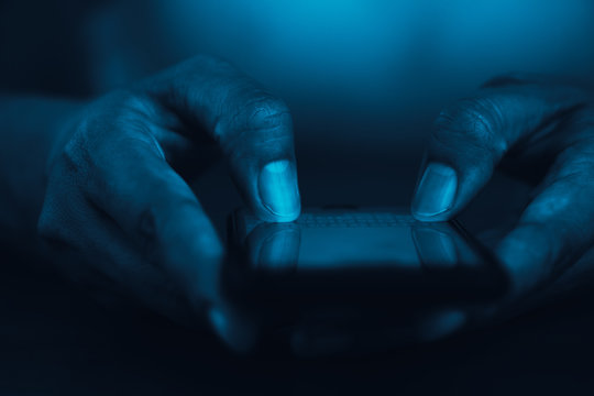 Close- up of men hand touching mobile on modern digital smartphone