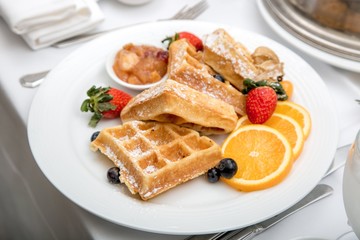 Waffles and orange fruit breakfast