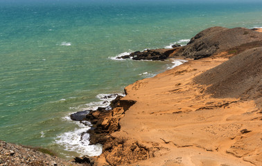 Fototapeta na wymiar Desertic coast of the sea in Cabo de la Vela, La Guajira, Colombia