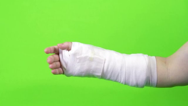 hand moving and splint isolated on green screen background