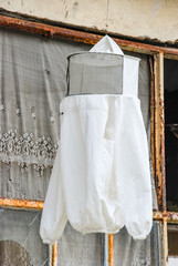 Fototapeta na wymiar White protective outfit. Beekeeping utility for beekeepers protection.