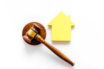 Inscribed gavel, house figure for inheritance concept on white background top view