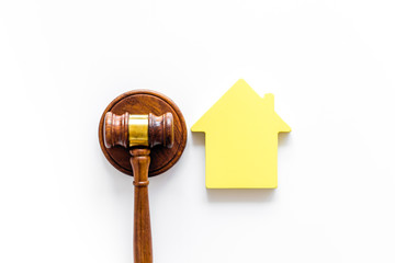 Inscribed gavel, house figure for inheritance concept on white background top view