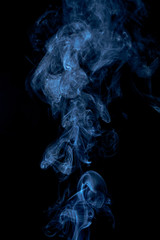Blue smoke on dark background