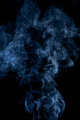Blue smoke on dark background
