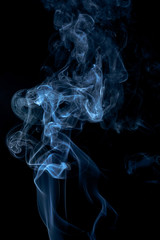Fototapeta premium Blue smoke on dark background