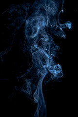 Blue smoke on dark background