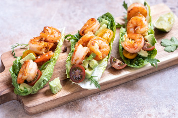 Lettuce wrapped Shrimp tacos with fresh tomato, avocado and lime