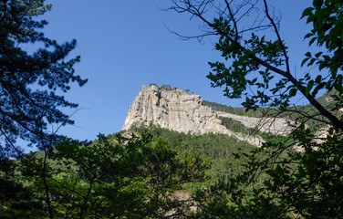 Mountain peak in summer against blue sky.