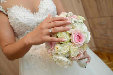  The bride, her wedding dress and the bouquet
