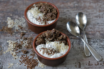 Healthy breakfast or dessert with Greek yogurt, chocolate granola and seeds. Keto diet.
