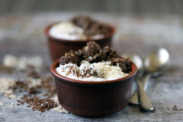 Healthy breakfast or dessert with Greek yogurt, chocolate granola and seeds. Keto diet.