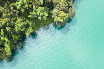 Sun Moon Lake in aerial with forest near the water
