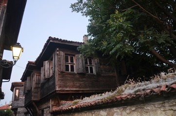  Nesabar, Bulgaria, 06/22/2017.   Wooden houses on street of Bulgarian Nesabar at the evening