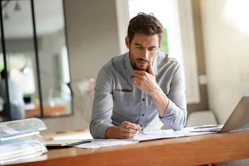 Modern man working in office