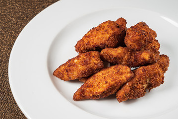 chicken nuggets on the white plate