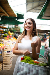 Beautiful women shopping vegetables and fruits on the market