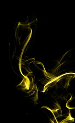 Yellow smoke on black background