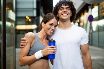 Portrait of young attractive happy fitness couple