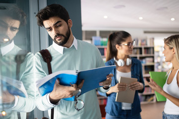 Obraz premium Group of friends studying together at university campus