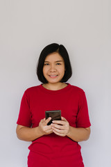 Happy smiling woman with smartphone on white background
