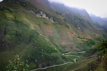 Dark and foggy scenery of mountains in Dong Van Karst Plateau Geopark in Sa phin, Vietnam