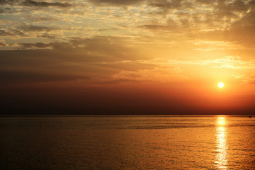 Beautiful sunrise over the sea on the coast of Sicily. Cefalu, Italy