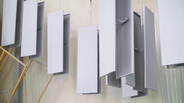 Metal panel moving on automated conveyor line at domestic appliances factory