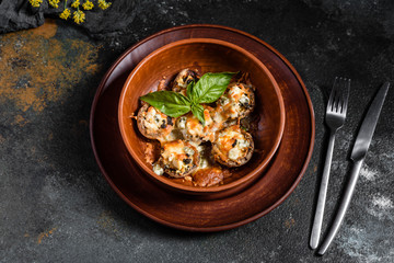 Caps of mushrooms champagne stuffed with four varieties of cheese and baked. Traditional Italian Mushroom Caps stuffed with Feta