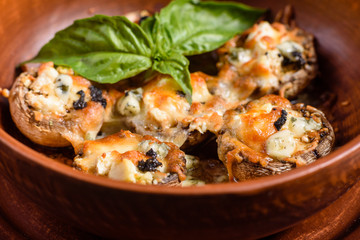 Caps of mushrooms champagne stuffed with four varieties of cheese and baked. Traditional Italian Mushroom Caps stuffed with Feta