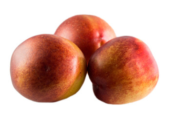 three peaches isolated on a white background