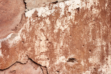 Texture of a concrete wall with cracks and scratches which can be used as a background