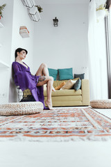 female with short haircut poses in Tbilisi loft