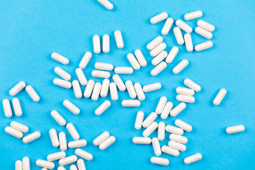 Tablets medicaments on a blue background