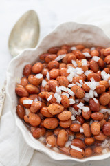 boiled beans with onion in white bowl