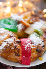 typical portuguese fruit cake Bolo rei on wooden background