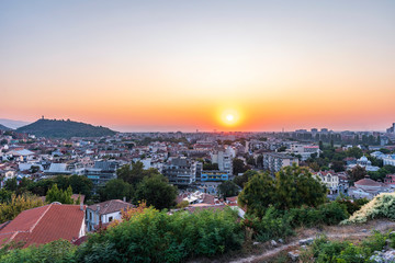 Summer sunset cityscape from Nebet tepe Hill in Plovdiv city, Bulgaria. Panoramic aerial view. Ancient Plovdiv is UNESCO's World Heritage and the oldest European city