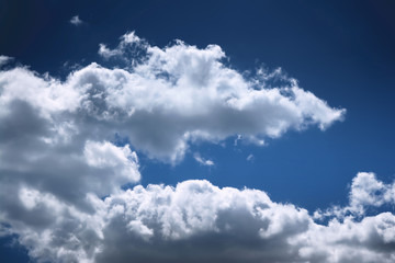 Dramatic colorful blue sky with white clouds